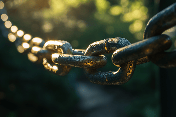 A long chain of metal links shining in sunlight