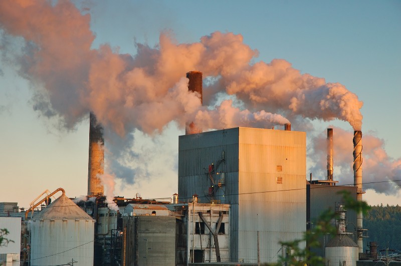 Factory with smoke coming out of stacks