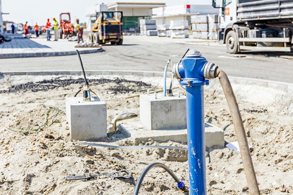 A blue fire hydrant on a construction site