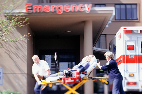 A stretcher being taken into outside of an emergency room