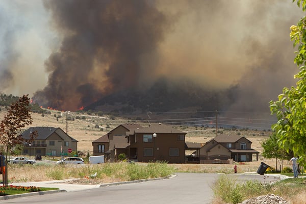 Forest fire close to a neighborhood