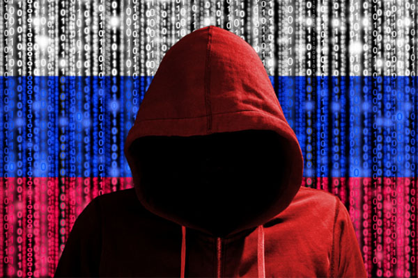 Red hooded sweatshirt in front of a Russian cyber code flag