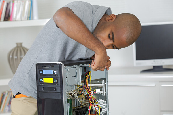 Gentleman repairing a broken computer