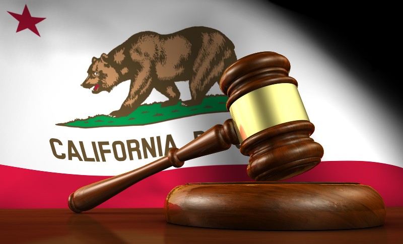 California flag with a wooden gavel in front