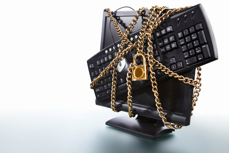 Computer monitor with gold lock and chain around it