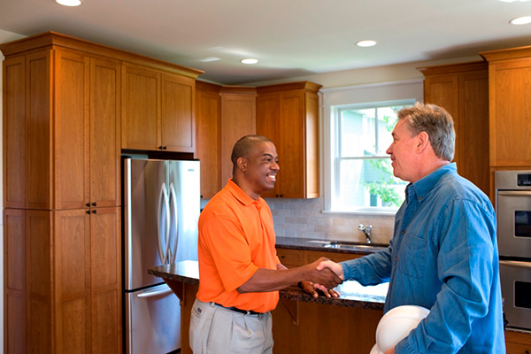 Homeowner shaking hands with a worker