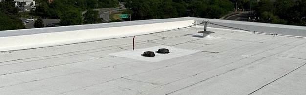 Commercial building roof with lifelines and fixed anchors