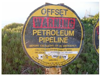 Sign that says Warning Petroleum Pipeline