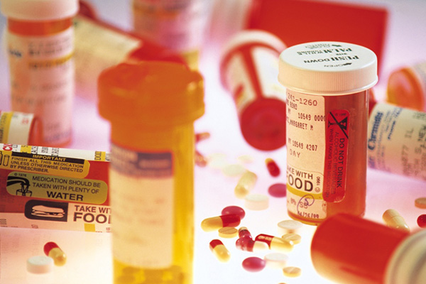 Prescription pill bottles and loose pills