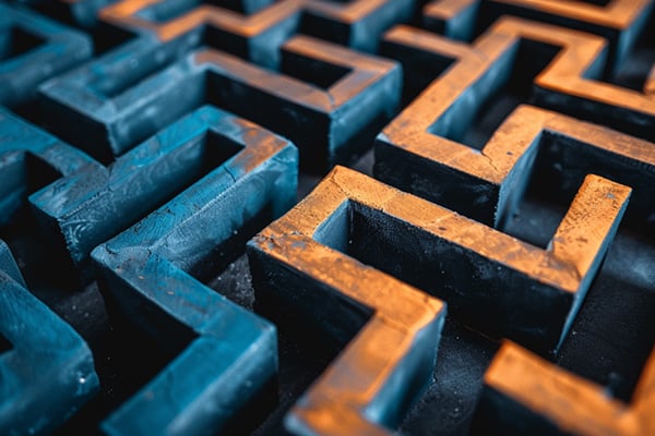 A three-dimensional maze in shades of blue and orange