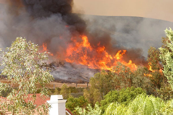 Wildfire approaching homes