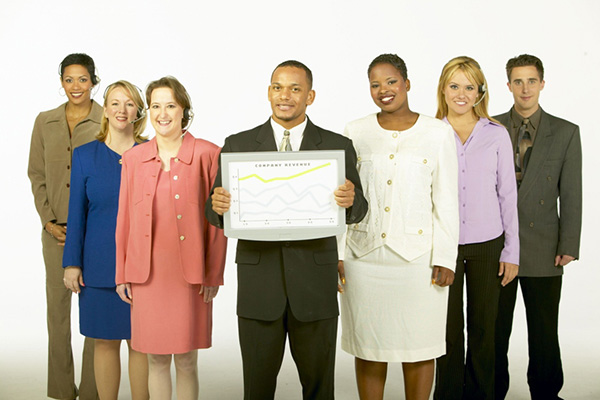 Groups of salespeople holding chart