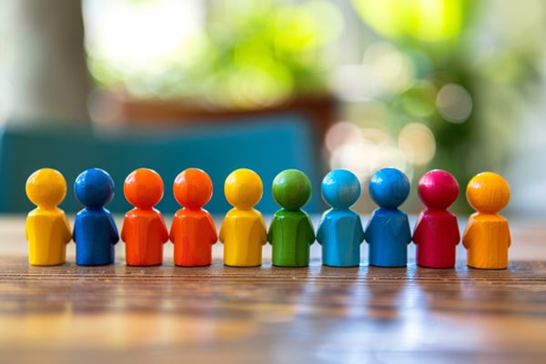 A row of small, multi-colored figurines.