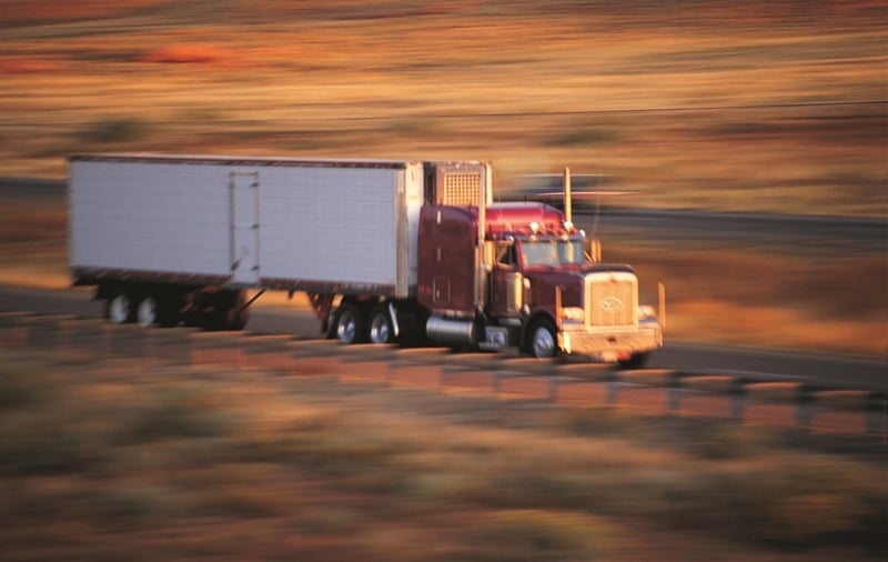 Semitruck on road with blurry background