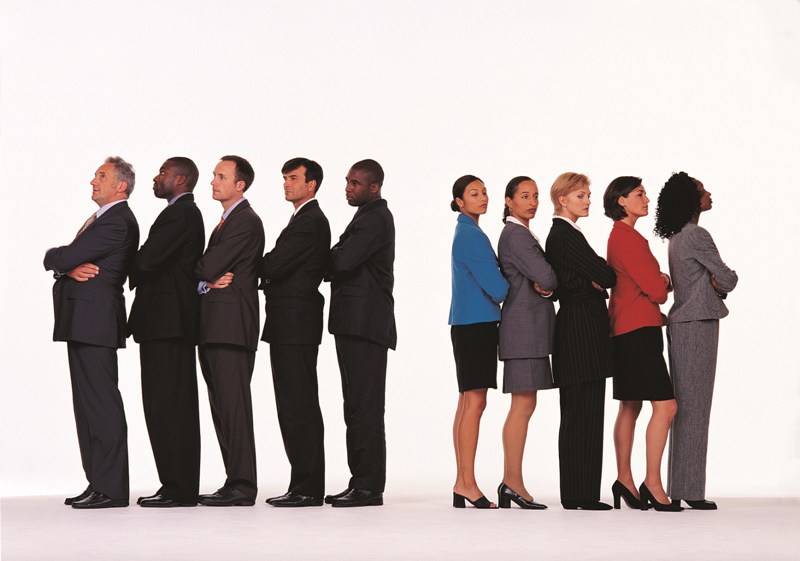Businessmen and women facing opposite directions