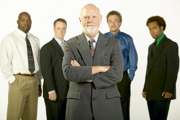 Older gentleman with group of younger men