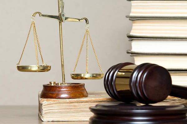 Justice scale, gavel, and books