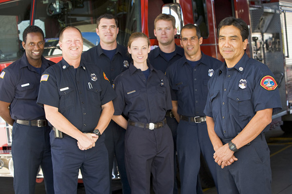 Firefighters in front of fire truck