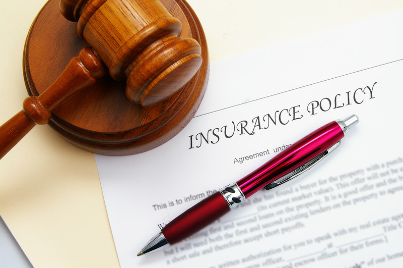 Insurance policy and gavel