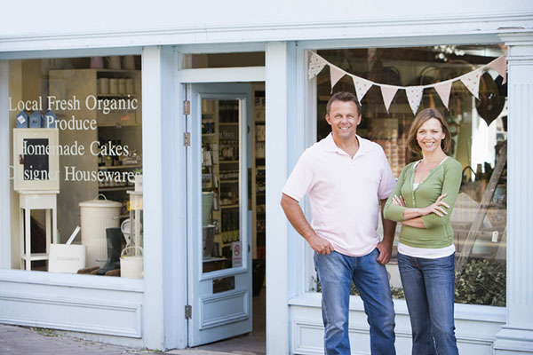 Couple standing in front of store