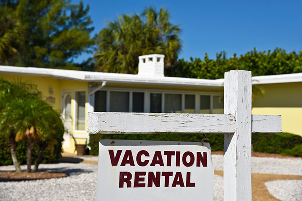 House with a vacation rental sign