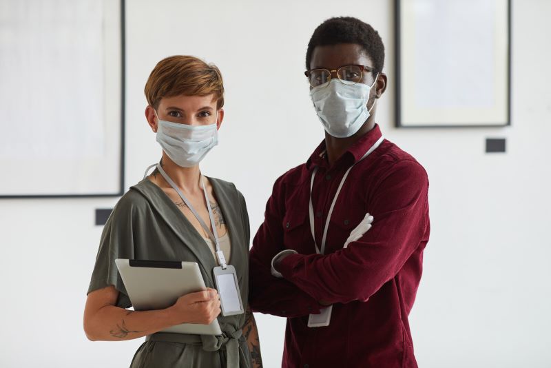 Two employees wearing medical masks